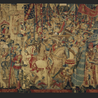 Medieval knights on horseback with lances in red and gold tapestry.