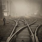 Industrial train station with converging railway tracks and parked trains