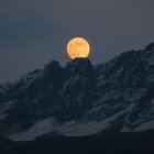 Lunar landscape with rugged rocky surface under starry sky