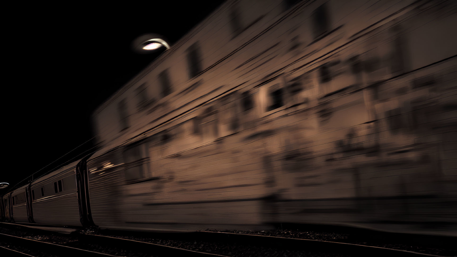 Nighttime train in motion by platform with ghostly motion blur against dark, moody backdrop and single