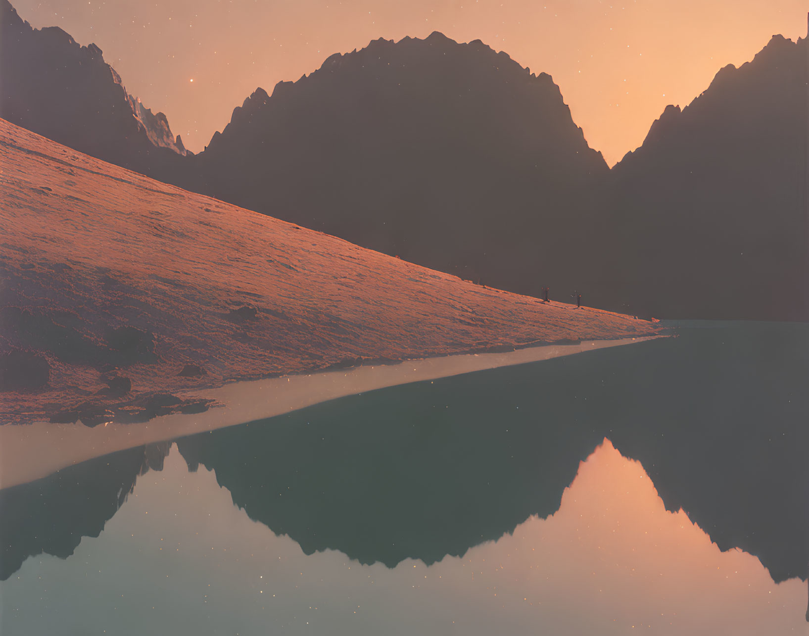 Tranquil snow-covered mountain slope with reflective lake and silhouetted peaks at dawn.