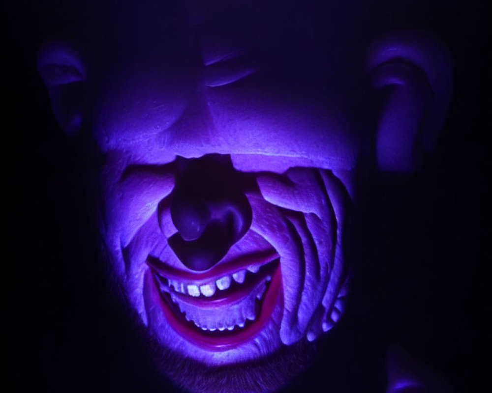 Creepy smiling purple mask under ultraviolet light