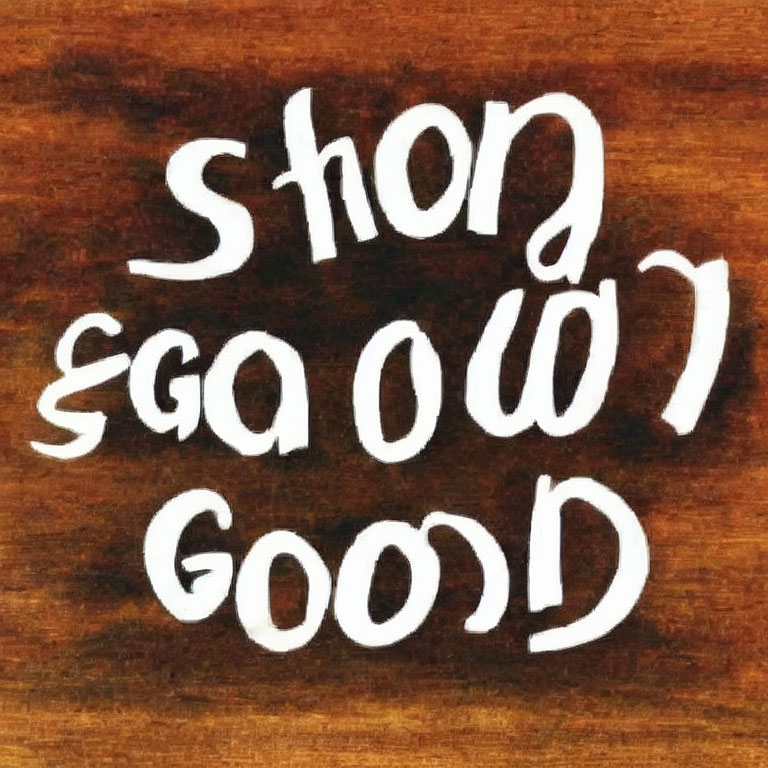 Ambigram design of "Short Good" in white text on wooden background