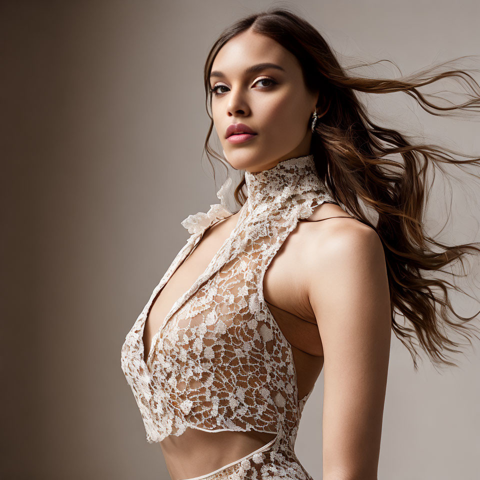 Woman in White Lace Garment Poses with Flowing Hair