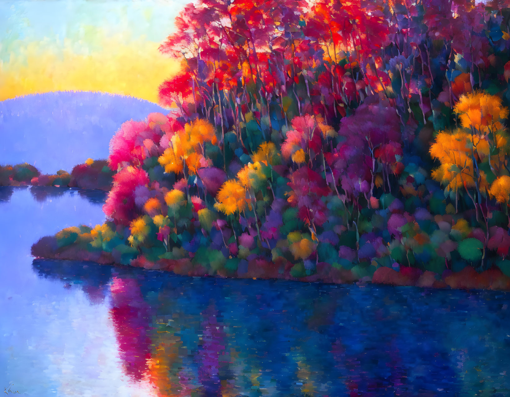 Colorful autumn trees reflecting on calm blue lake at sunset