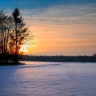 Vibrant winter dusk scene with colorful sky and snow-covered landscape