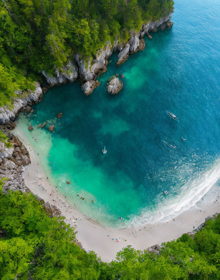 Secluded Tropical Beach Cove with Turquoise Water and Anchored Boats