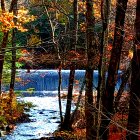 Serene Landscape with House by Winding River in Autumn