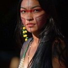 Digital portrait of woman with tribal makeup, jewelry, braided hair, teardrop headpiece,