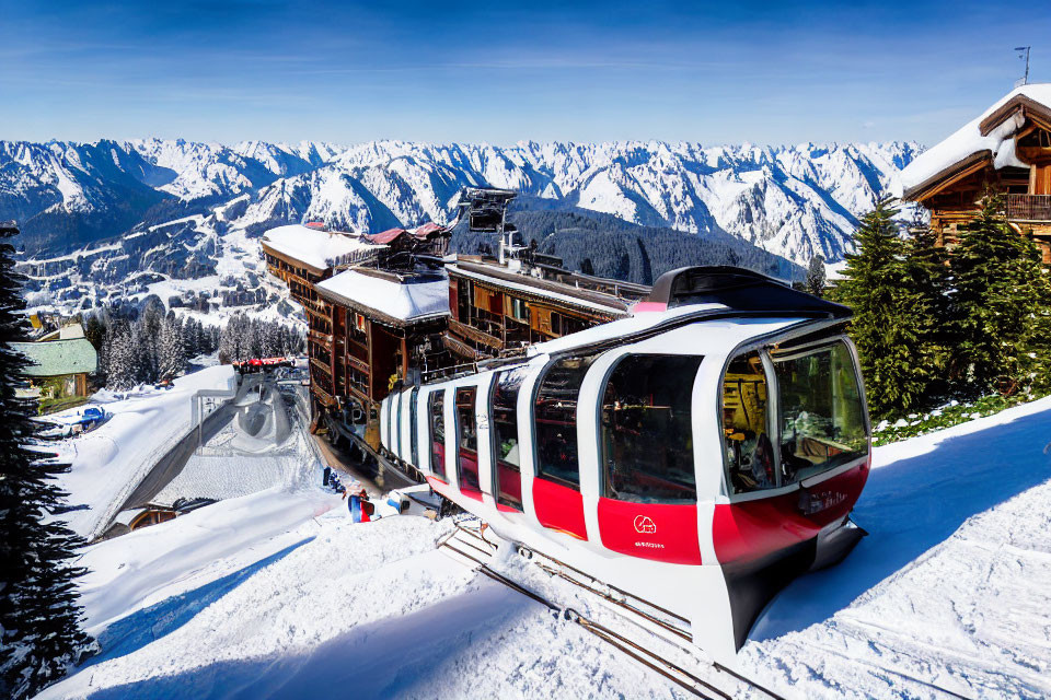 Scenic red and white tram on snowy mountain slopes