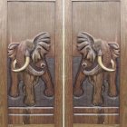 Intricate Tiger Carvings on Wooden Double Doors