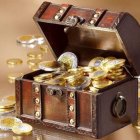 Luxurious treasure chest with pearls, gold, and gemstones on soft backdrop