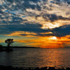 Scenic beach sunset with open gates and orange hues