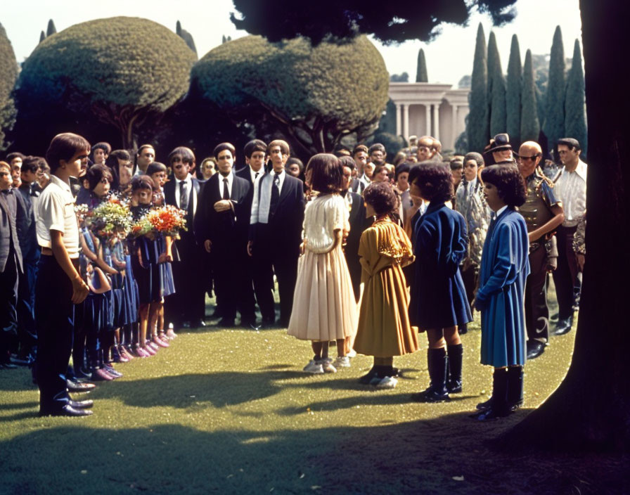 Formal Attire Group with Children Holding Floral Tribute