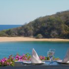 Serene beach dining table with ocean view