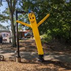 Vibrant Outdoor Scene with Inflatable Tube Figure