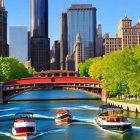 Cityscape with skyscrapers, red bridge, boats on a sunny day