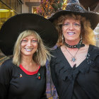 Two Women in Witch Costumes with Elaborate Autumn Hats