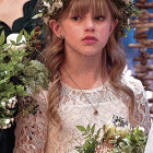 Young Woman in Floral Crown and Vintage Lace Dress