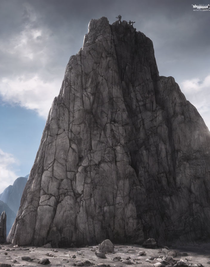 Majestic jagged rock formation with lone climber under cloudy sky