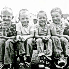 Group of elderly men in overalls and hats socializing with wine bottles on table