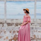 Woman in Pink Gown Standing in Wildflower Field