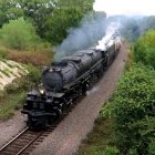 Colorful steam train in Van Gogh-inspired landscape