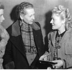 Monochromatic pencil drawing of three women with intricate hairstyles and elegant attire