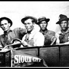 Vintage Illustration: Five Men in Hats in 1930s Gangster Style Sitting in Car