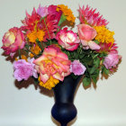 Colorful Pink and Yellow Roses in Dark Blue Vase with Paint Splashes