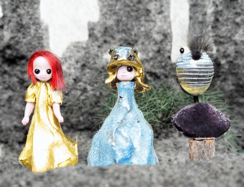 Handmade dolls in whimsical designs on gray background