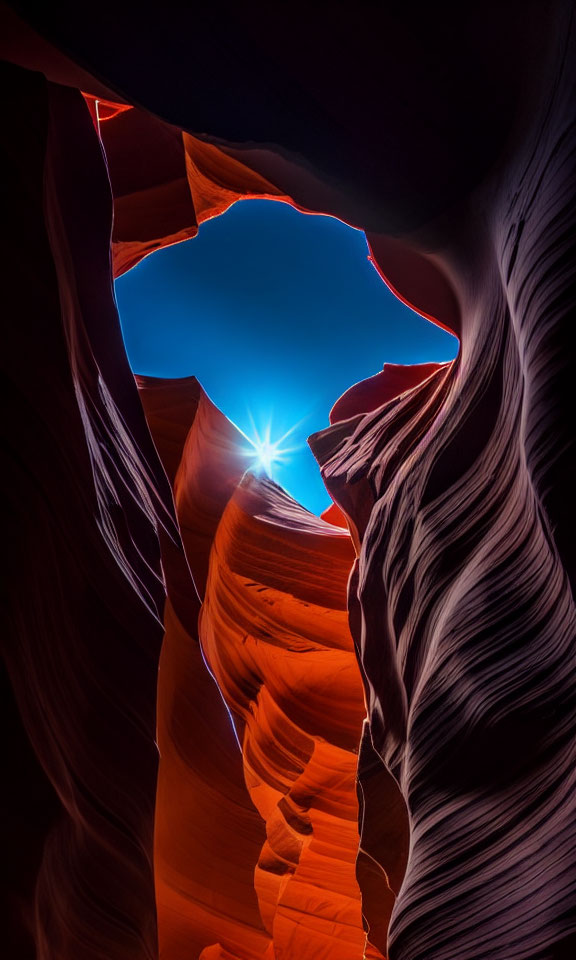 Sunburst illuminates vibrant orange-red slot canyon formations