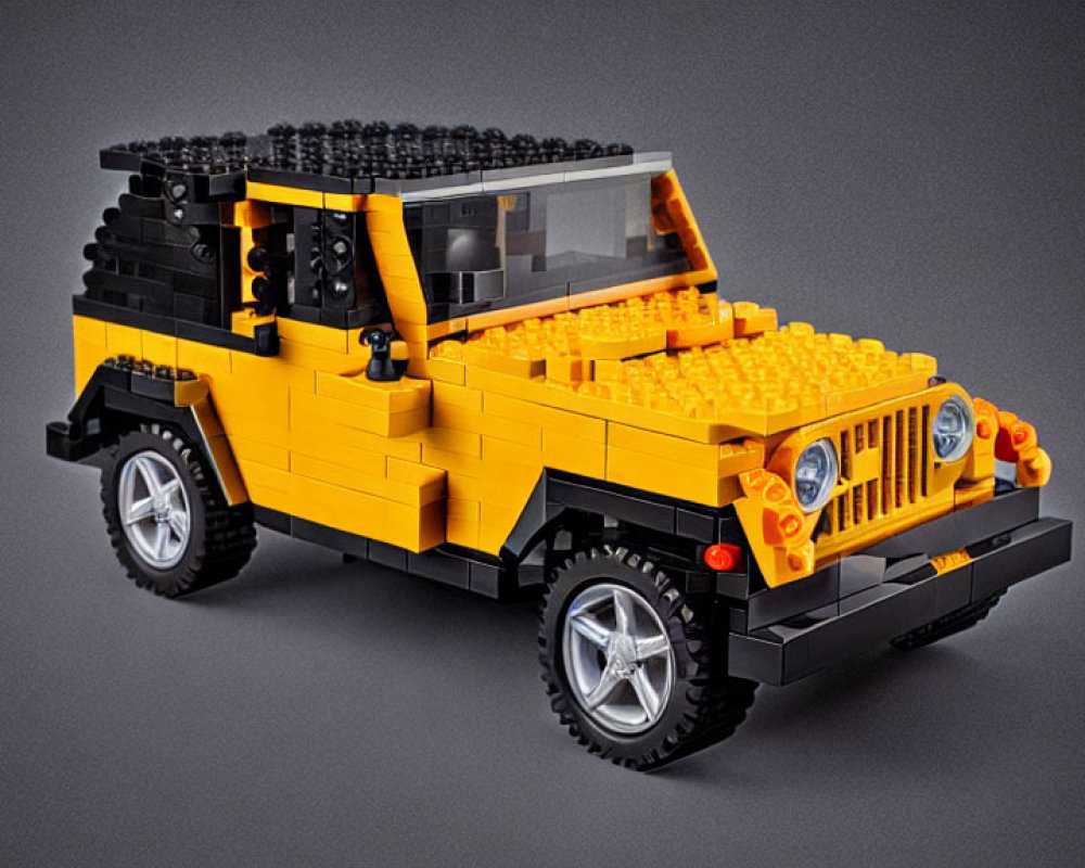 Detailed LEGO Yellow and Black Off-Road Vehicle Model with Silver Rims