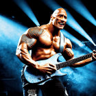 Tattooed man playing electric guitar on blue stage background