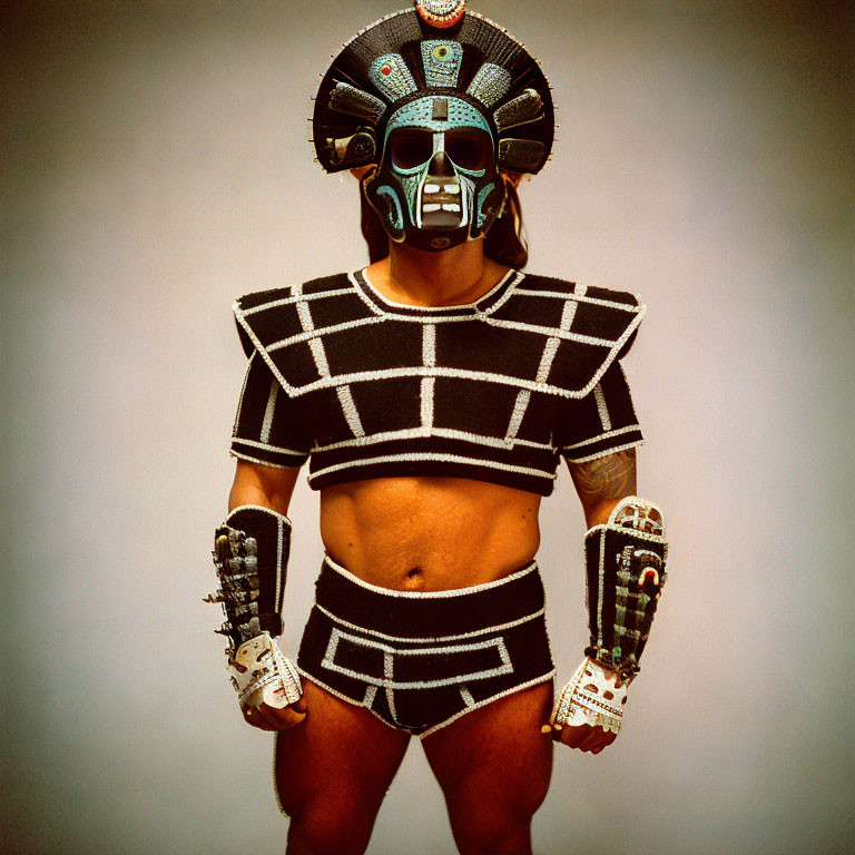 Futuristic costume with helmet and arm pieces on person against neutral backdrop