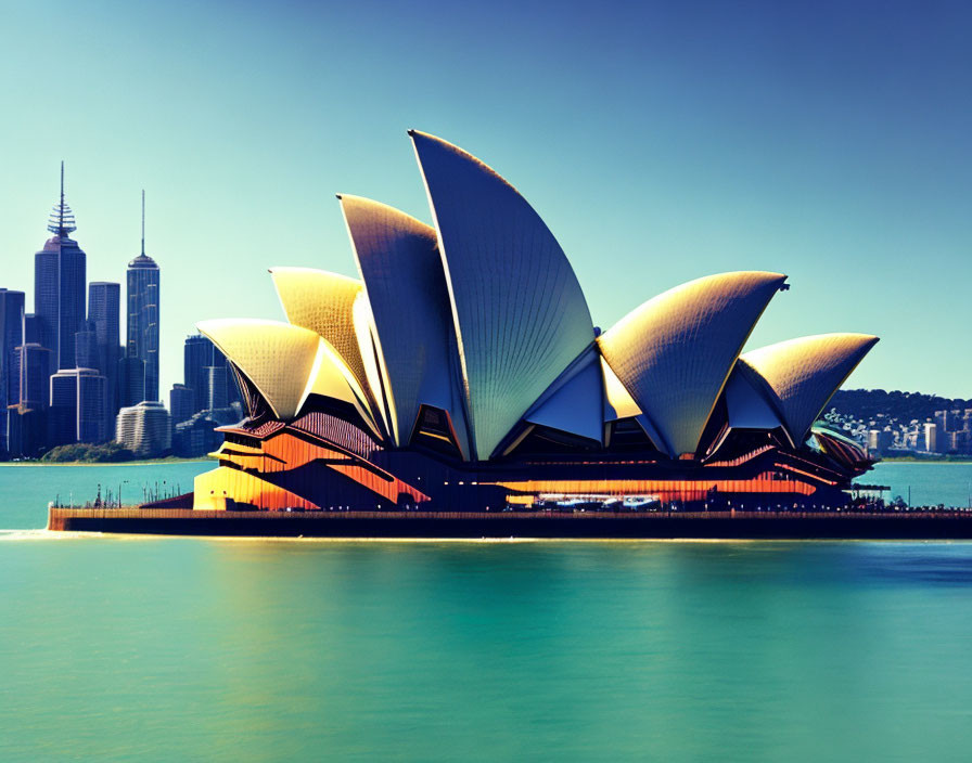 Iconic Sydney Opera House waterfront view against city skyline.