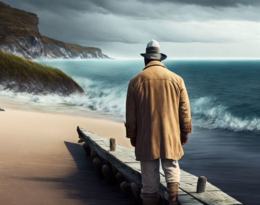 Person in coat and hat on pier gazes at stormy sea with cliffs