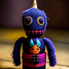 Colorful Handmade Crochet Doll with Button Eyes and Horn, Holding Tiny Orange Creature