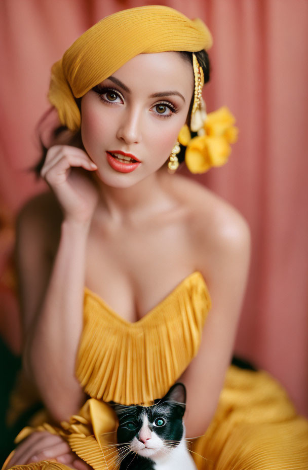 Glamorous Model in Yellow Dress with Cat on Lap