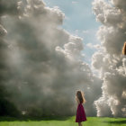 Young girl in pink dress admires fluffy clouds in sunlit field