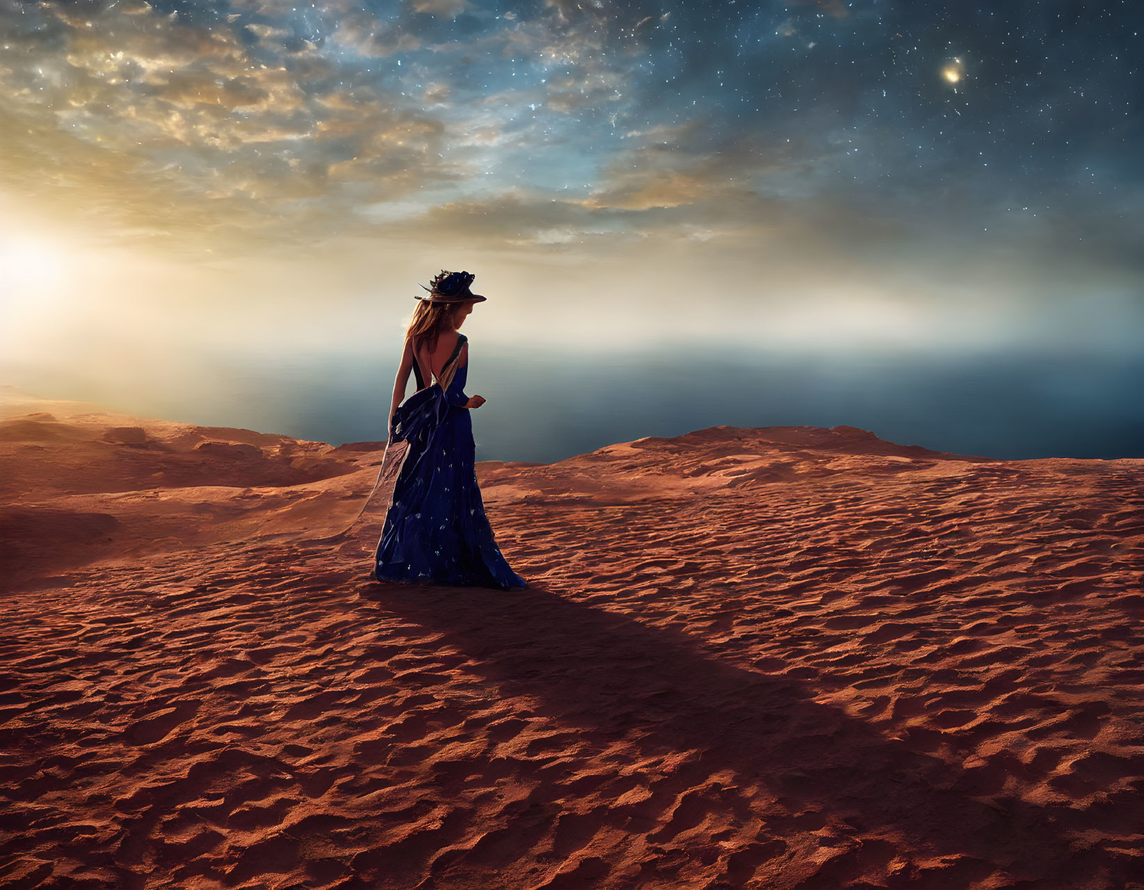 Woman in blue dress on sandy desert under twilight sky