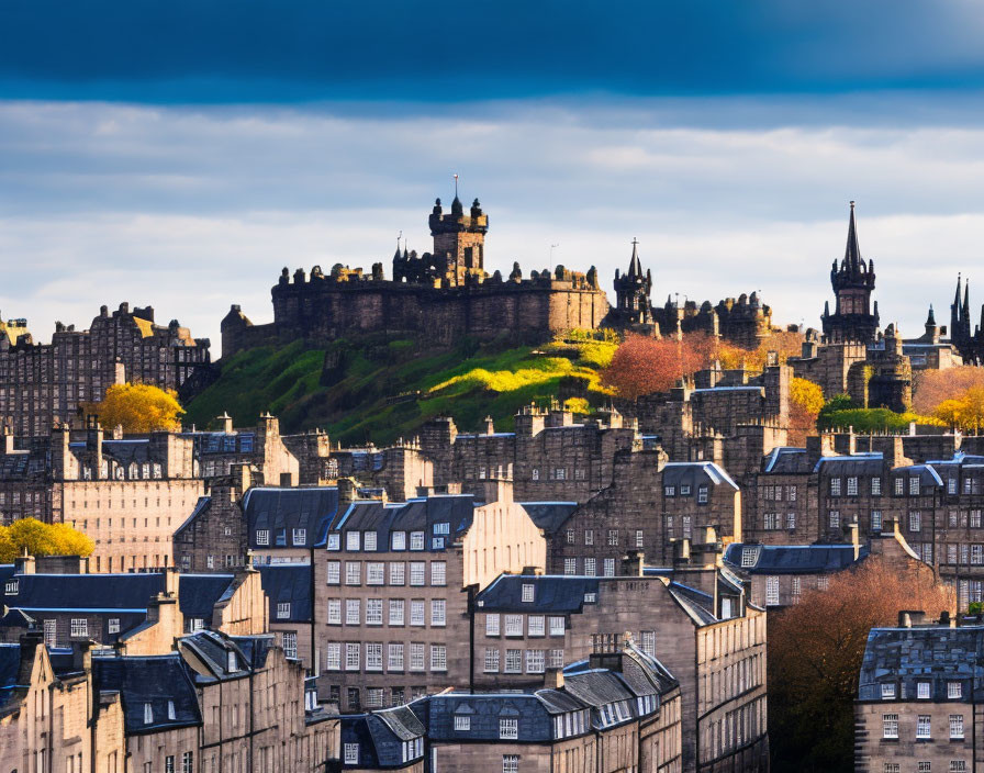 Historic Edinburgh skyline with castle and old buildings under cloudy sky