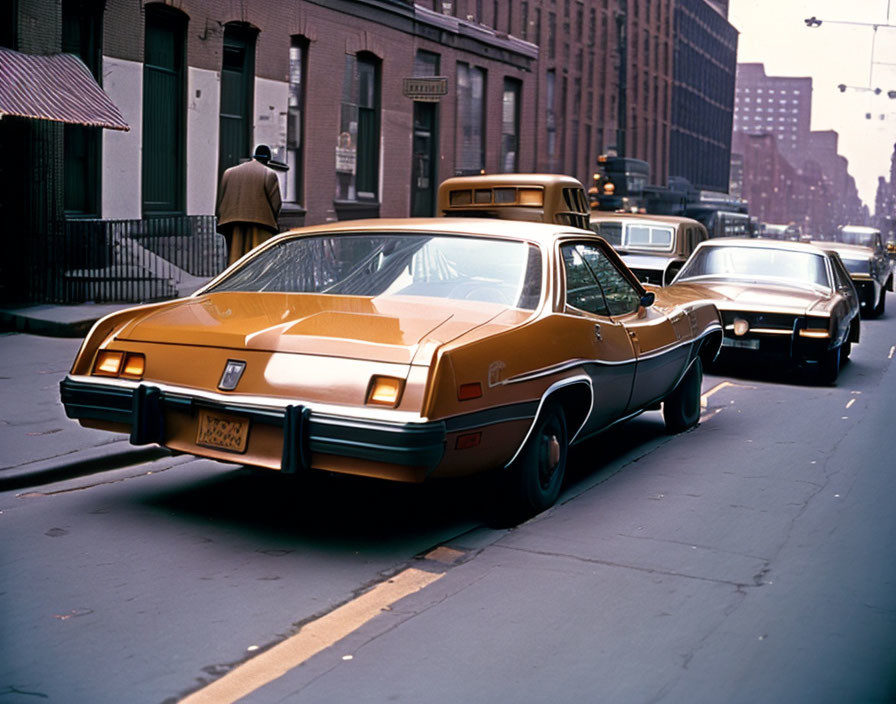 Vintage Brown and Tan Car with Distinctive Rear Styling in City Setting