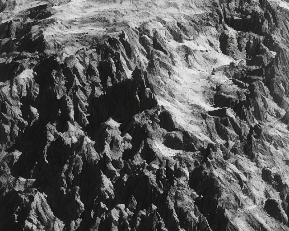 Monochrome aerial view of rugged mountain landscape