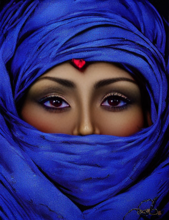 Person with Striking Eyes in Vibrant Blue Scarf and Red Bindi