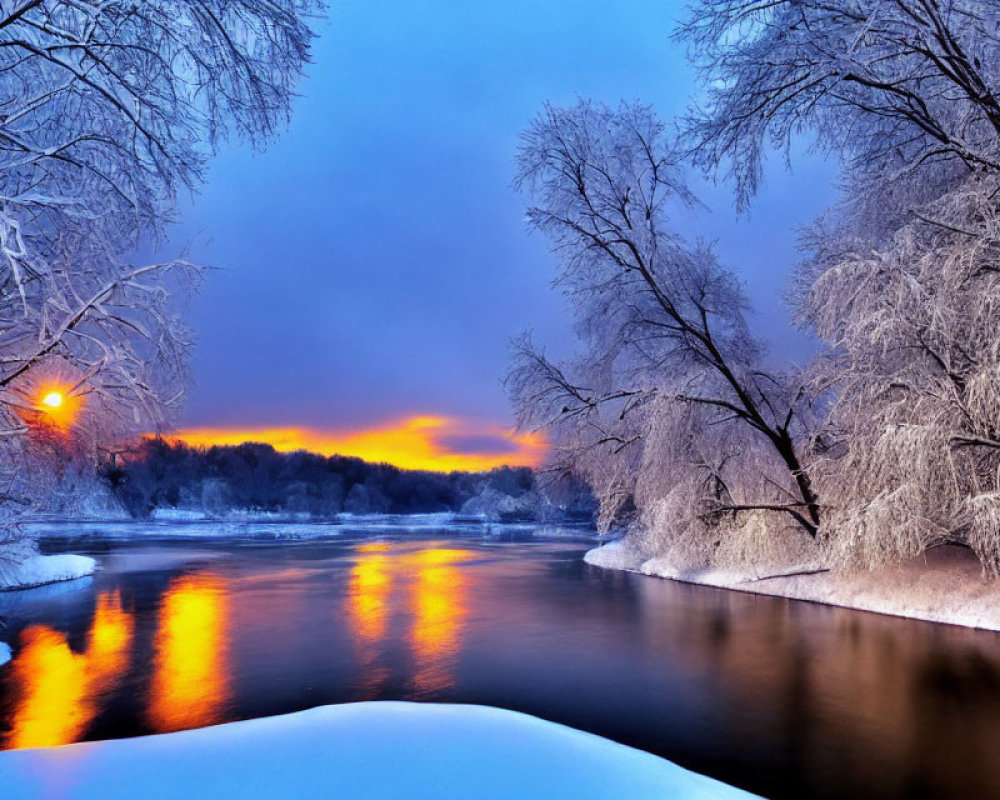 Snow-covered trees and river at sunset in serene winter landscape