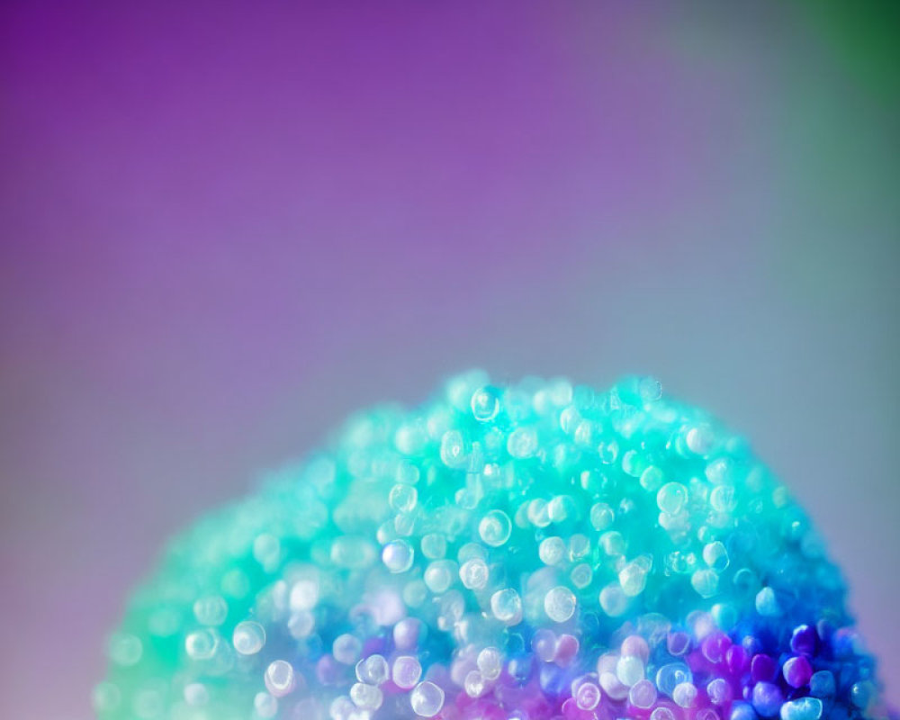 Detailed Close-Up of Purple to Teal Gradient Beaded Object