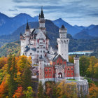 Castle in Snowy Mountains with Stone Towers & Red Flags