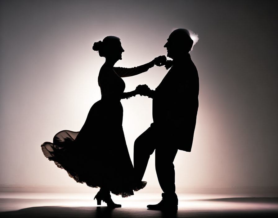 Elegant couple dancing in classic style with flowing dress and hat, against warm backdrop