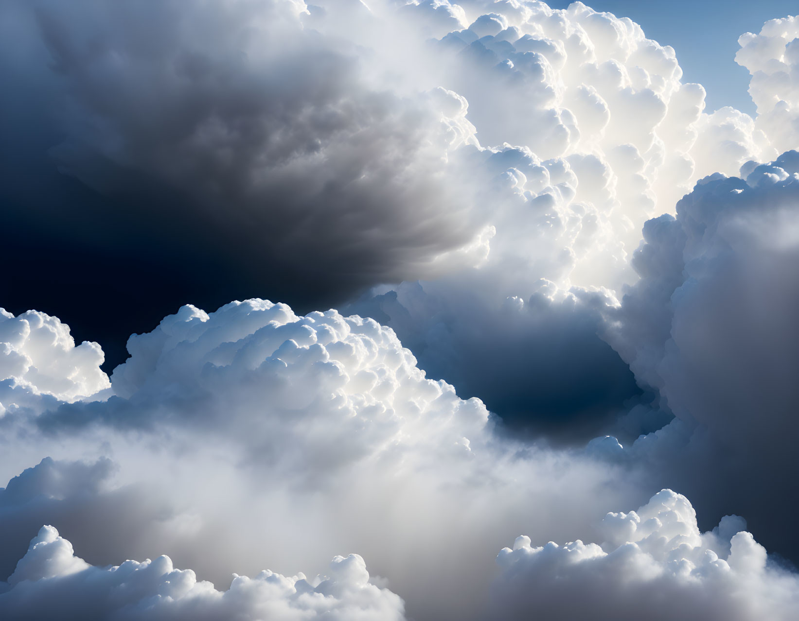 Dramatic sky with sunlight filtering through cumulus clouds